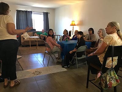 guests at the Meow-Mixer cat-lovers potluck lunch event