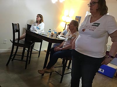 guests at the Meow-Mixer cat-lovers potluck lunch event