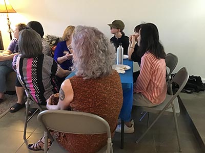 guests at the Meow-Mixer cat-lovers potluck lunch event