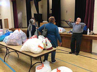 neighbors volunteering at Women4Women Tempe service project (packing party)