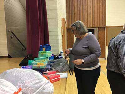 neighbors volunteering at Women4Women Tempe service project (packing party)