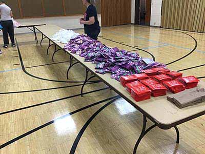 neighbors volunteering at Women4Women Tempe service project (packing party)