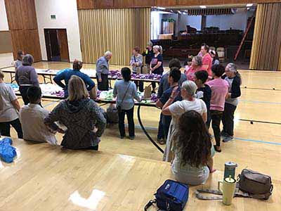 neighbors volunteering at Women4Women Tempe service project (packing party)