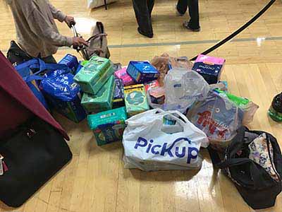 neighbors volunteering at Women4Women Tempe service project (packing party)