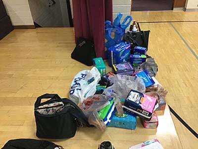 neighbors volunteering at Women4Women Tempe service project (packing party)