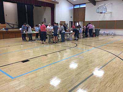 neighbors volunteering at Women4Women Tempe service project (packing party)