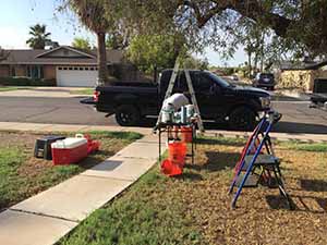 neighbors gather to scrape and paint trim on home of elderly neighbor Nellice Reidhead