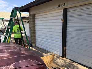 neighbors gather to scrape and paint trim on home of elderly neighbor Nellice Reidhead