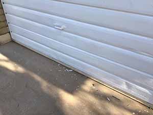 neighbors gather to scrape and paint trim on home of elderly neighbor Nellice Reidhead