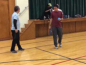 neighbors playing pickleball