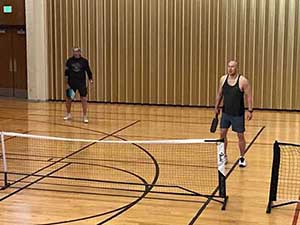 neighbors playing pickleball