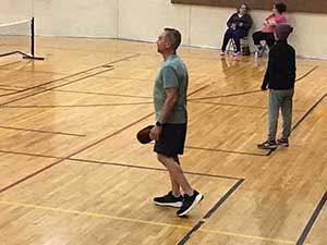 neighbors playing pickleball