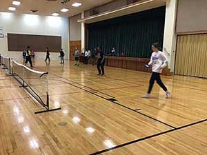 neighbors playing pickleball