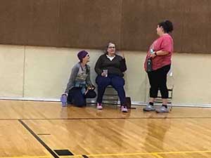 neighbors playing pickleball