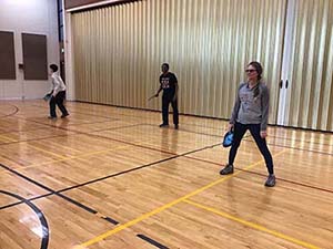 neighbors playing pickleball