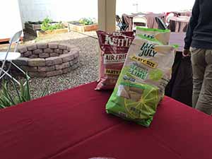 neighbors gather at for Thanksgiving Day potluck dinner