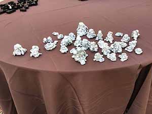 neighbors gather at for Thanksgiving Day potluck dinner