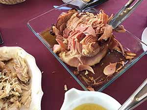 neighbors gather at for Thanksgiving Day potluck dinner