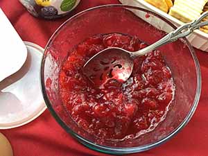 neighbors gather at for Thanksgiving Day potluck dinner