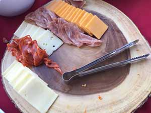 neighbors gather at for Thanksgiving Day potluck dinner
