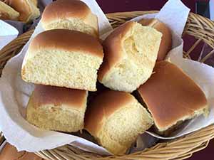neighbors gather at for Thanksgiving Day potluck dinner