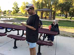 neighbors gather at park for potluck dinner birthday party