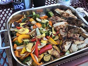 neighbors gather at park for potluck dinner birthday party