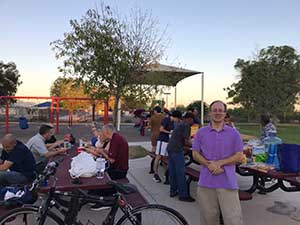 neighbors gather at park for potluck dinner birthday party