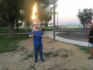 neighbors gather at park for potluck dinner birthday party