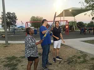 neighbors gather at park for potluck dinner birthday party