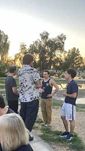 neighbors gather at park for potluck dinner birthday party