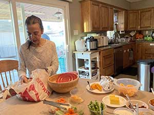 Tempe area neighbors gather at a watch party to watch the movie Hamnet