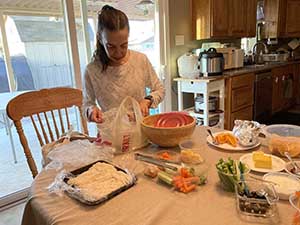 Tempe area neighbors gather at a watch party to watch the movie Hamnet