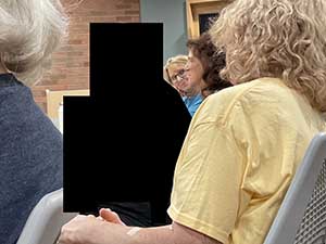 Tempe area neighbors at book club meeting in Tempe Public Library discussing the novel Hamnet