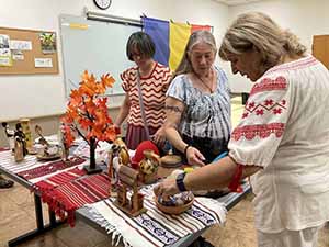 Tempe area neighbors at potluck dinner celebrating Romania