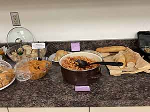Tempe area neighbors at potluck dinner celebrating Romania