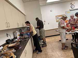 Tempe area neighbors at potluck dinner celebrating Romania