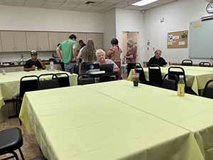 Tempe area neighbors at potluck dinner celebrating Romania