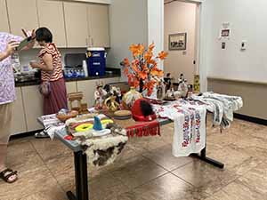 Tempe area neighbors at potluck dinner celebrating Romania