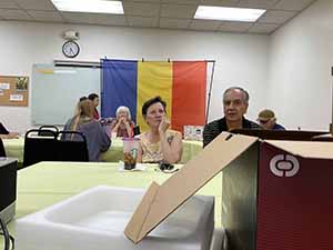 Tempe area neighbors at potluck dinner celebrating Romania