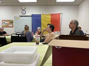 Tempe area neighbors at potluck dinner celebrating Romania
