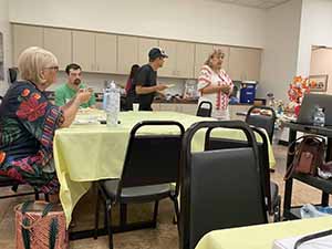 Tempe area neighbors at potluck dinner celebrating Romania