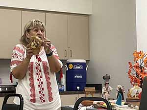 Tempe area neighbors at potluck dinner celebrating Romania