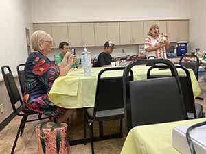 Tempe area neighbors at potluck dinner celebrating Romania