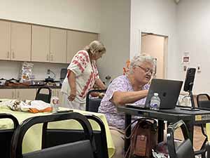 Tempe area neighbors at potluck dinner celebrating Romania