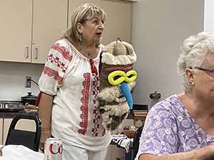 Tempe area neighbors at potluck dinner celebrating Romania