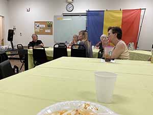 Tempe area neighbors at potluck dinner celebrating Romania